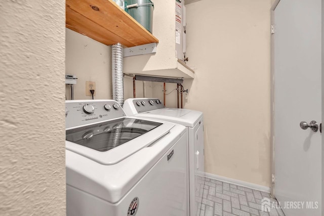 laundry area with separate washer and dryer