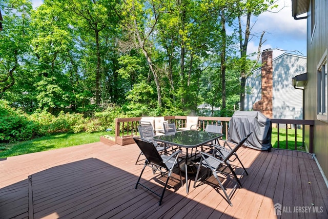 17 Theodore Dr, East Brunswick, NJ 08816 - wooden deck featuring area for grilling and outdoor dining area