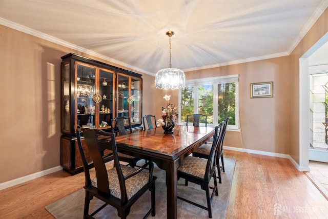 17 Theodore Dr, East Brunswick, NJ 08816 - dining room with a chandelier, plenty of natural light, light wood-style flooring, and ornamental molding
