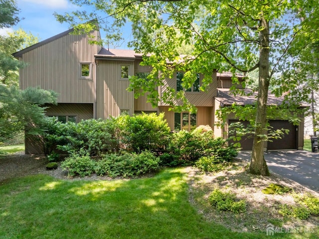 17 Theodore Dr, East Brunswick, NJ 08816 - view of front of home with driveway, a front lawn, and a garage