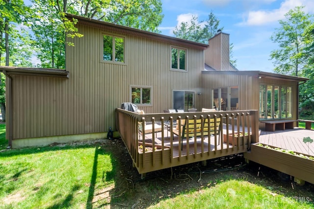 17 Theodore Dr, East Brunswick, NJ 08816 - rear view of property featuring a yard, a chimney, and a wooden deck