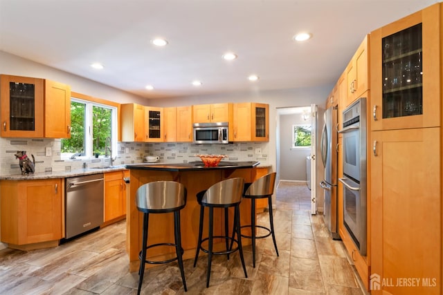 17 Theodore Dr, East Brunswick, NJ 08816 - kitchen featuring stainless steel appliances, recessed lighting, tasteful backsplash, glass insert cabinets, and a center island