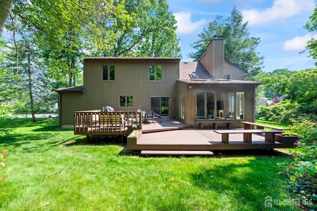 17 Theodore Dr, East Brunswick, NJ 08816 - rear view of house with a chimney, a yard, and a wooden deck