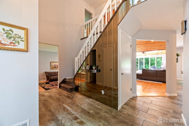 17 Theodore Dr, East Brunswick, NJ 08816 - stairs with a high ceiling and wood finished floors