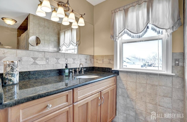 bathroom featuring tile walls and vanity