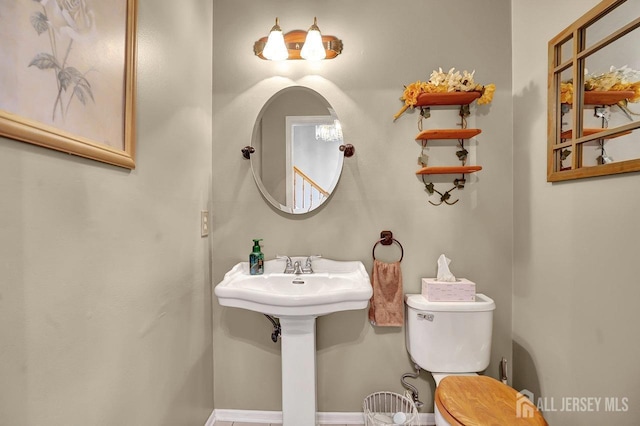 97 Laurel Ave, Hazlet, NJ 07734 - half bathroom featuring toilet and baseboards