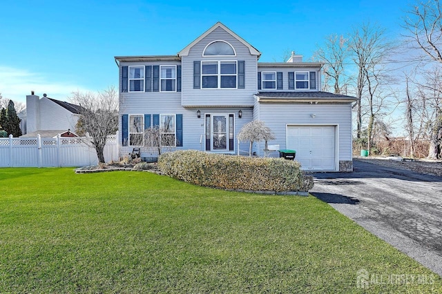 97 Laurel Ave, Hazlet, NJ 07734 - view of front of home featuring fence, an attached garage, driveway, a front yard, and a chimney