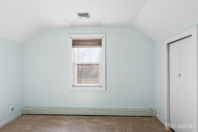 additional living space with lofted ceiling, carpet floors, baseboard heating, and visible vents