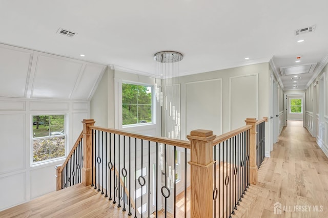737 Wingate Dr, Bridgewater, NJ 08807 - corridor featuring a decorative wall, attic access, crown molding, an upstairs landing, and light wood finished floors