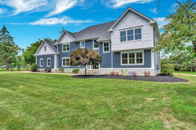 737 Wingate Dr, Bridgewater, NJ 08807 - rear view of house with a yard and board and batten siding