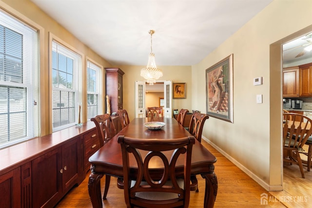 545 Myrtle Ave, Woodbridge Proper, NJ 07095 - dining room with a chandelier and light wood finished floors