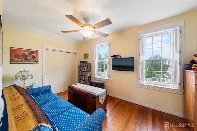 545 Myrtle Ave, Woodbridge Proper, NJ 07095 - bedroom with radiator heating unit, a closet, hardwood / wood-style floors, and ceiling fan