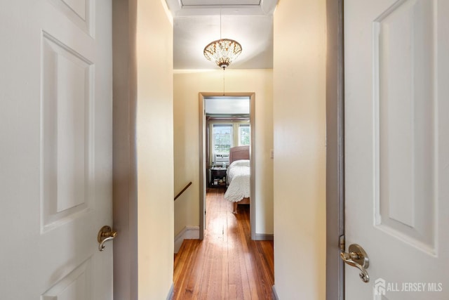 545 Myrtle Ave, Woodbridge Proper, NJ 07095 - hall featuring hardwood / wood-style flooring, an upstairs landing, and attic access