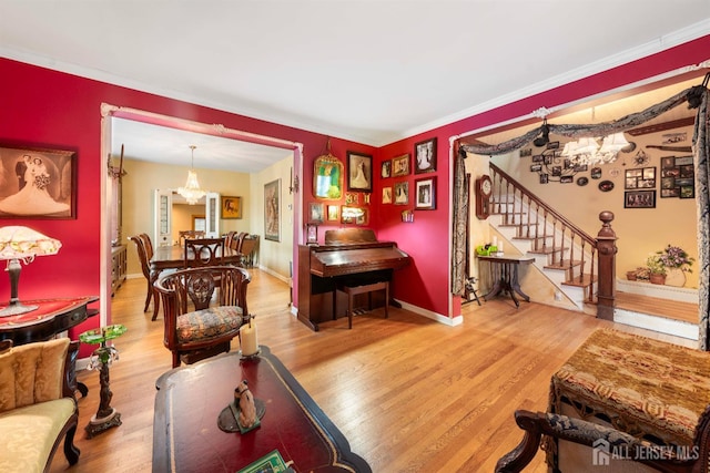 545 Myrtle Ave, Woodbridge Proper, NJ 07095 - living area featuring a chandelier, wood finished floors, stairs, and crown molding
