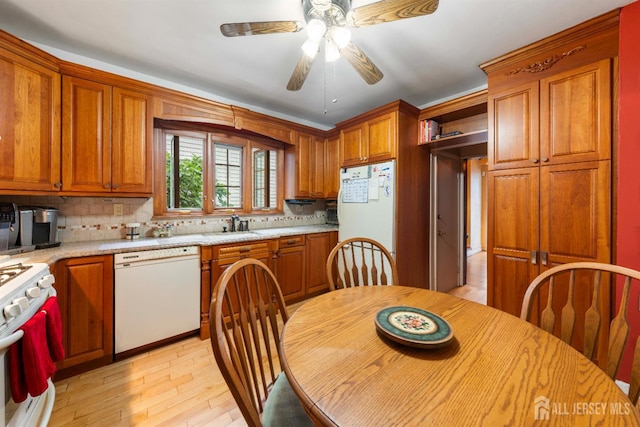 545 Myrtle Ave, Woodbridge Proper, NJ 07095 - kitchen with white appliances, light countertops, ceiling fan, light wood-type flooring, and decorative backsplash