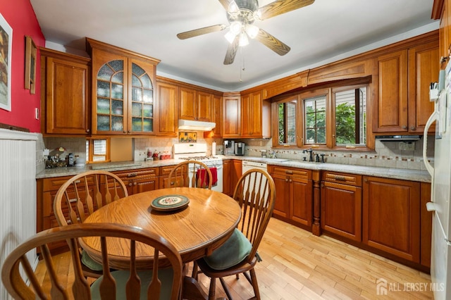 545 Myrtle Ave, Woodbridge Proper, NJ 07095 - kitchen featuring white appliances, under cabinet range hood, tasteful backsplash, and brown cabinets