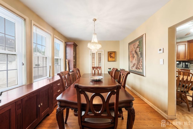 545 Myrtle Ave, Woodbridge Proper, NJ 07095 - dining area with a chandelier and light wood-type flooring