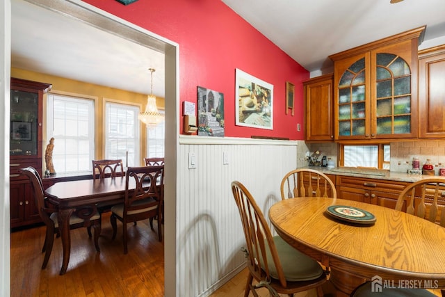 545 Myrtle Ave, Woodbridge Proper, NJ 07095 - dining room featuring wood-type flooring, a wainscoted wall, healthy amount of natural light, and a chandelier