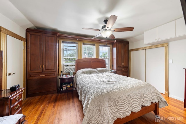 545 Myrtle Ave, Woodbridge Proper, NJ 07095 - bedroom featuring a closet, wood finished floors, a ceiling fan, and cooling unit