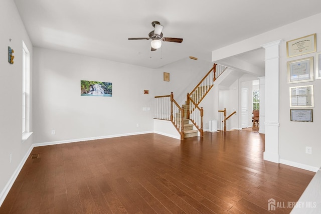 unfurnished living room featuring ceiling fan, stairway, wood finished floors, and baseboards