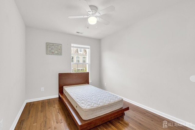 1202 Ella Ln, Highland Park, NJ 08904 - bedroom with wood finished floors, baseboards, and a ceiling fan