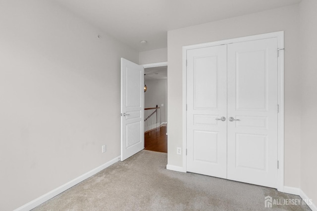 1202 Ella Ln, Highland Park, NJ 08904 - unfurnished bedroom featuring carpet, baseboards, and a closet
