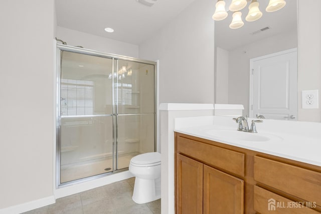 bathroom featuring vanity, a notable chandelier, toilet, a stall shower, and visible vents