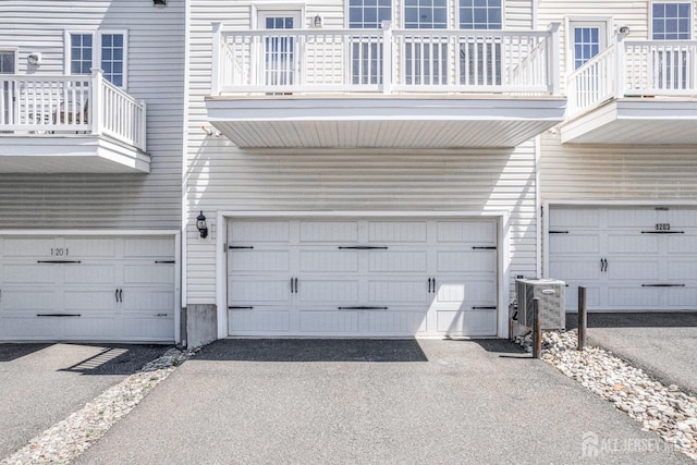 garage featuring driveway