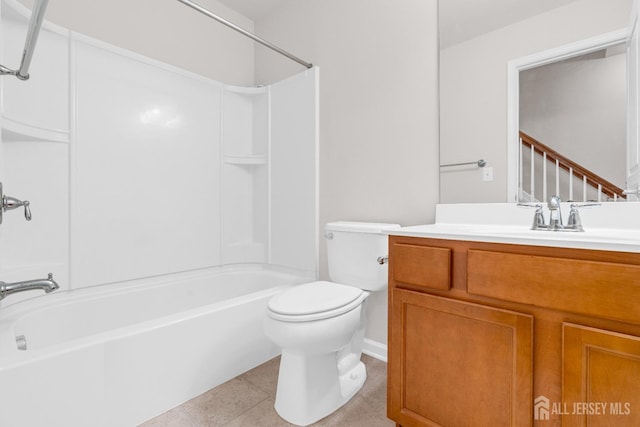 bathroom with washtub / shower combination, toilet, tile patterned flooring, and vanity
