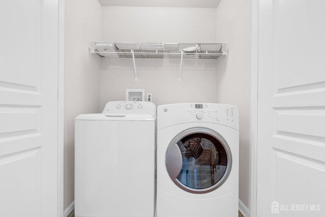 laundry area featuring independent washer and dryer and laundry area