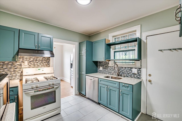 kitchen with white gas range oven, under cabinet range hood, stainless steel dishwasher, a sink, and light countertops