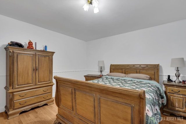 bedroom featuring light wood-style flooring