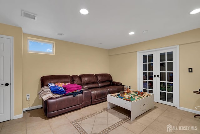 living room featuring visible vents, recessed lighting, french doors, and baseboards