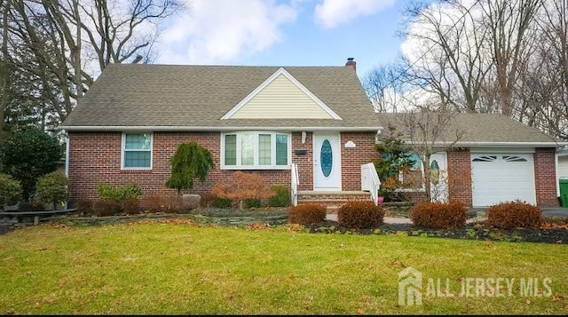 view of front of house with a garage and a front yard