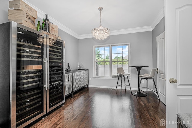 5 Bridle Ct, Monroe, NJ 08831 - bar featuring wine cooler, a chandelier, wood finished floors, crown molding, and baseboards