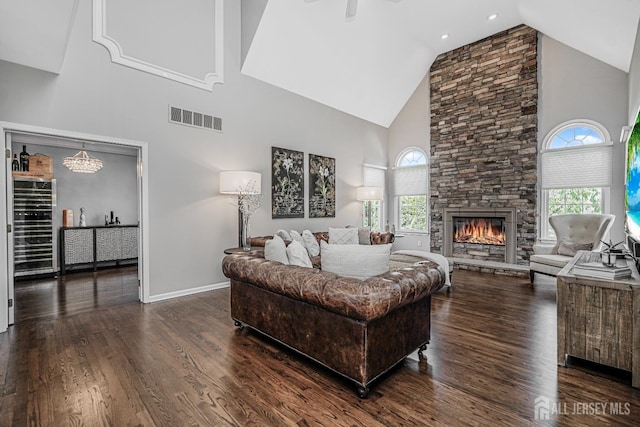 5 Bridle Ct, Monroe, NJ 08831 - living area with high vaulted ceiling, plenty of natural light, a stone fireplace, and dark wood-type flooring