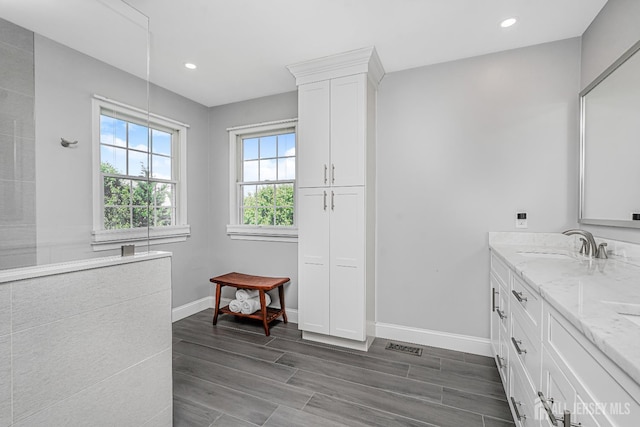 5 Bridle Ct, Monroe, NJ 08831 - bathroom featuring double vanity, baseboards, wood finished floors, and recessed lighting