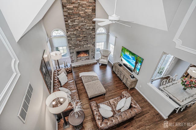 5 Bridle Ct, Monroe, NJ 08831 - living area featuring high vaulted ceiling, ceiling fan, plenty of natural light, a fireplace, and wood finished floors