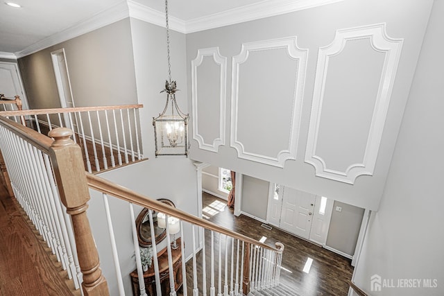 5 Bridle Ct, Monroe, NJ 08831 - staircase featuring wood finished floors, crown molding, a chandelier, and baseboards