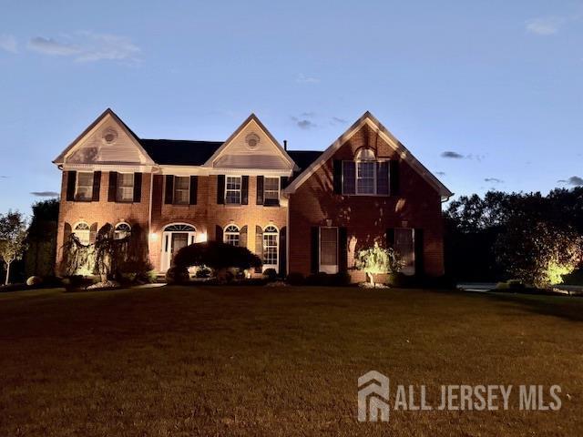 5 Bridle Ct, Monroe, NJ 08831 - view of front of home featuring a front lawn and brick siding