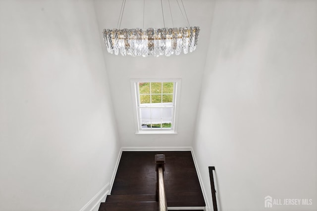 2 Hitching Post Pl, Monroe, NJ 08831 - stairs featuring baseboards, wood finished floors, and a chandelier