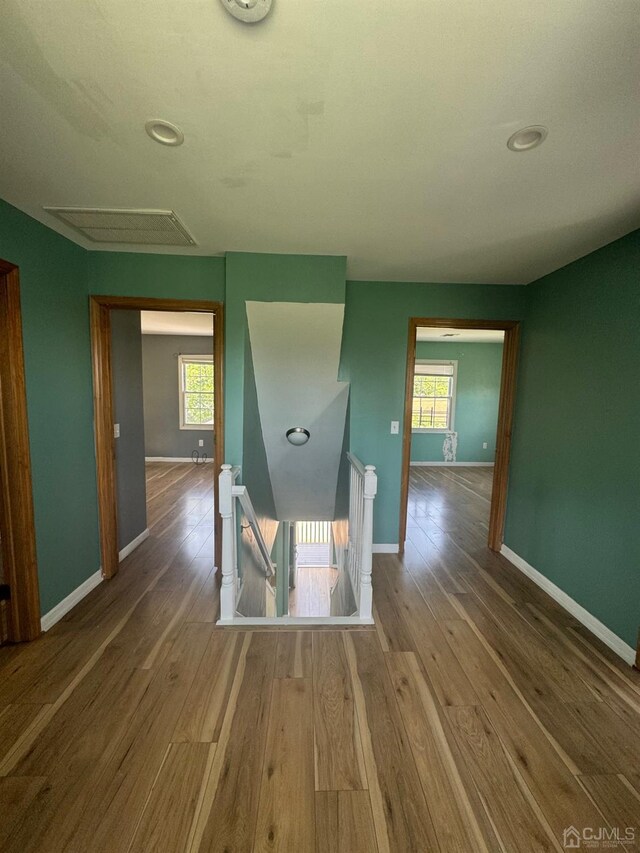 hallway featuring wood-type flooring