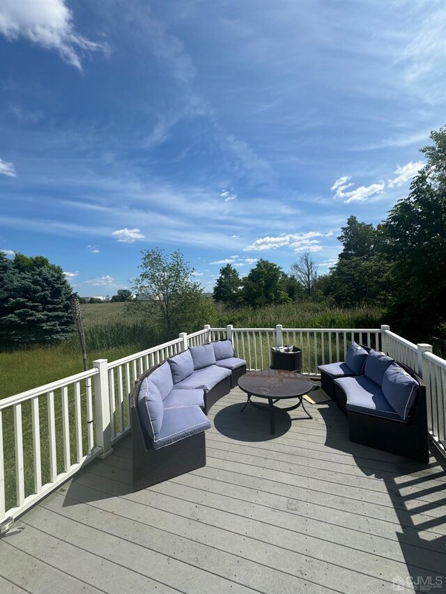 wooden deck featuring an outdoor hangout area