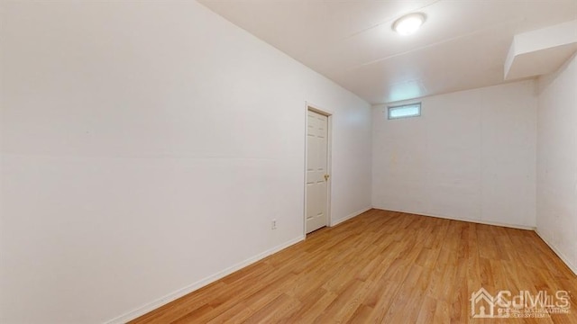 spare room featuring light hardwood / wood-style floors