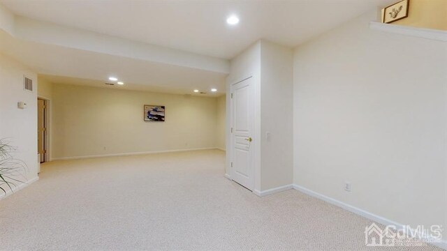 basement with light colored carpet