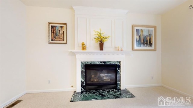 room details featuring a fireplace and carpet floors