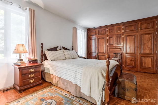 bedroom with parquet floors