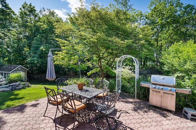5 Meade Ct, Piscataway, NJ 08854 - view of patio / terrace featuring area for grilling, outdoor dining space, and an outbuilding