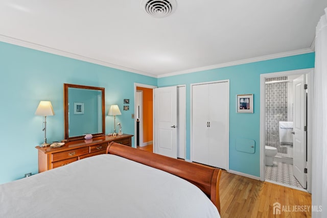 5 Meade Ct, Piscataway, NJ 08854 - bedroom featuring two closets, light wood-type flooring, crown molding, and ensuite bathroom