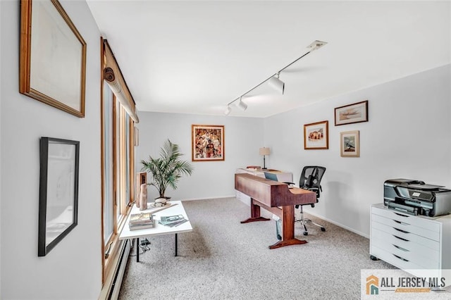 office featuring baseboards, carpet, a baseboard heating unit, and rail lighting
